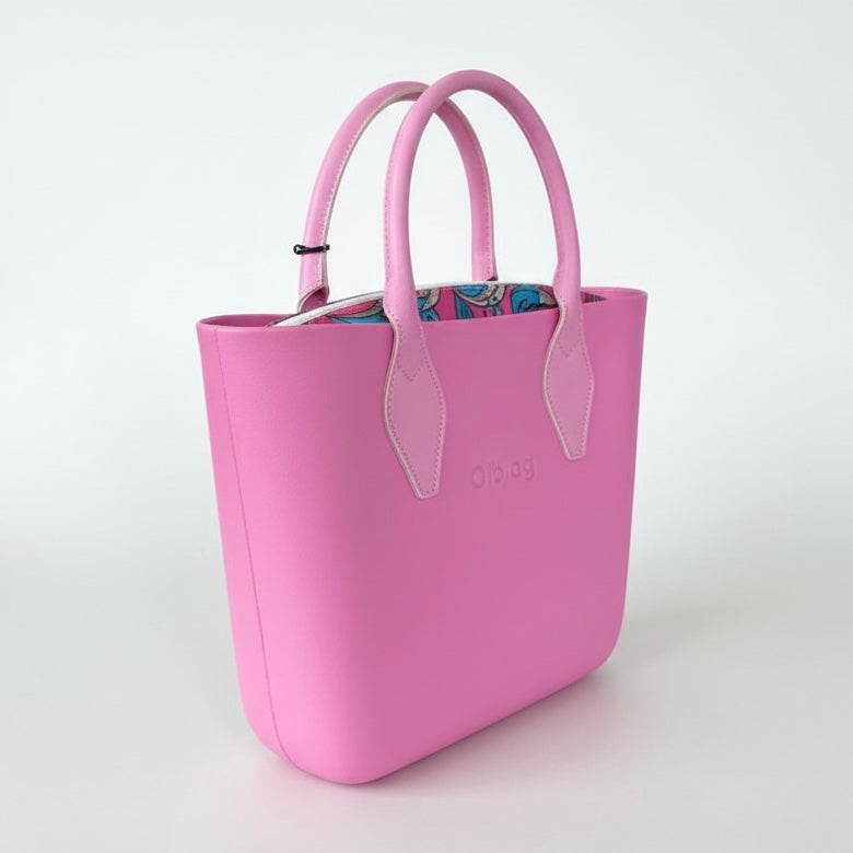 Obag pink handbag for women with detachable handles, durable thermoplastic, lightweight and easy to clean.