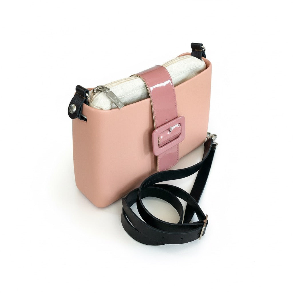 Obag shoulder bag with detachable strap in salmon color, made from durable thermoplastic material.